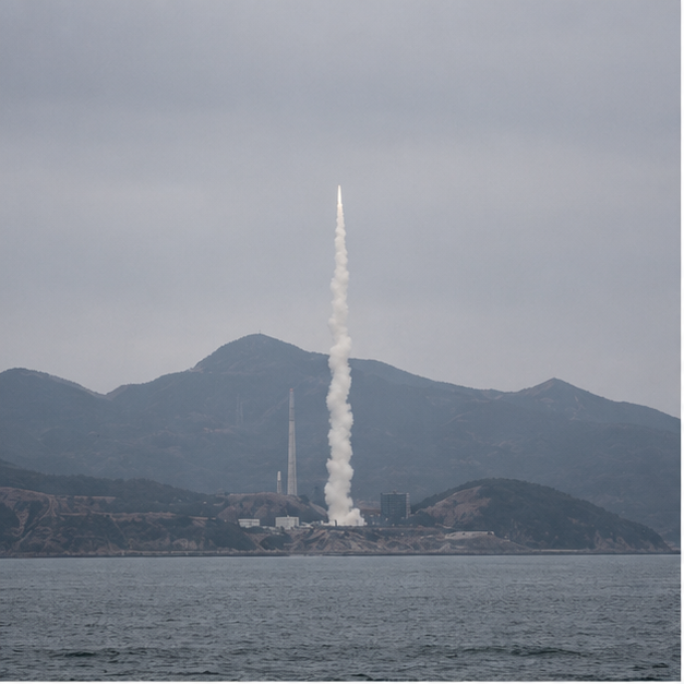 Remote missile industrial test plume over sea